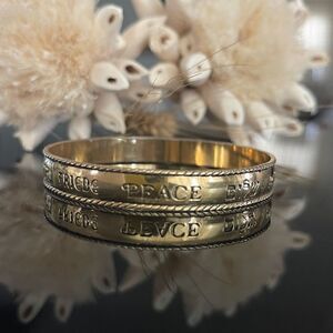 Avon Peace bangle gold tone
